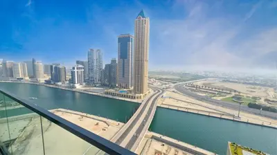 a view of a city with a river and buildings at Zada Tower , near to Burj Khalifa NYE fireworks in Dubai