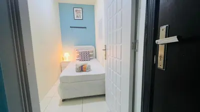 a small room with a bed in a hallway at Wow Partition Room In Barsha 1 Near MOE Metro in Dubai