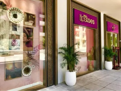 a store front with a potted plant in front at Luxury 1BR Retreat @ Vida Residences - Creek Beach in Dubai