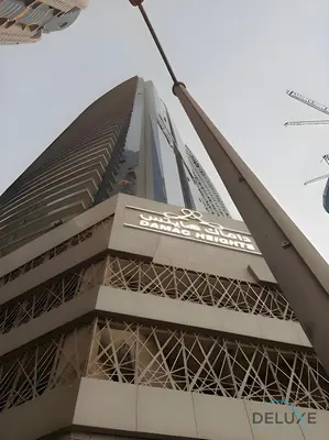 a view of the belle tower from the street at Wondrous 1BR at DAMAC Heights Dubai Marina by Deluxe Holiday Homes in Dubai