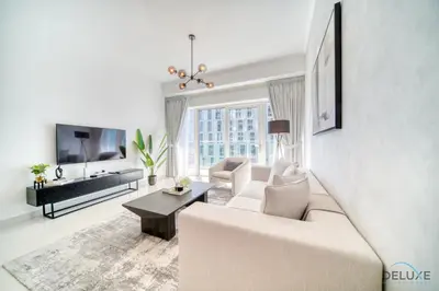 a living room with a couch and a tv at Wondrous 1BR at DAMAC Heights Dubai Marina by Deluxe Holiday Homes in Dubai