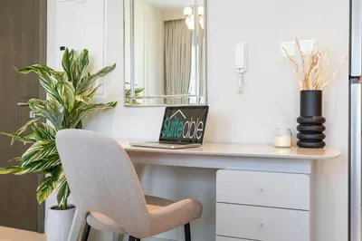 a room with a desk with a chair and a mirror at Elegant apartment in Dubai Creek Harbour in Dubai