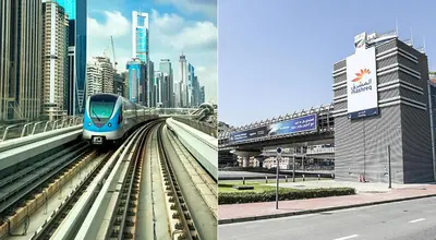 a blue train on the tracks in a city at Spacious Mini Partition Room Near Emirates Mall in Dubai