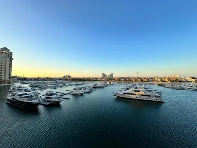 a group of boats are docked in a harbor at Manzil - 3BR in Palm Jumeirah with Private Beach Access & Sea View in Dubai