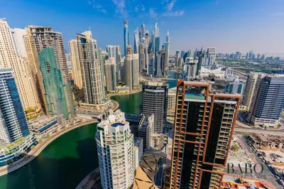 an aerial view of a city with tall buildings at The Sophisticated Suite in Dubai