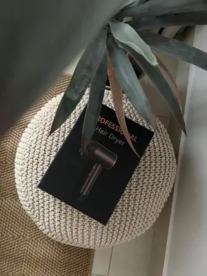 a card sitting on top of a chair with a plant at SmartApt Elegant 1 BDR Burj view in Dubai