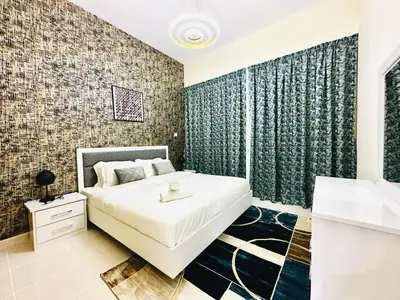 a bedroom with a large bed and a bathroom at Elegant 2 BR in Dubai Marina walking Metro & Beach- Marina Park in Dubai