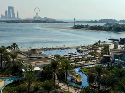 a view of a resort with a beach and a body of water at Upgraded 1BR Paradise With Private Garden - Oceana in Dubai