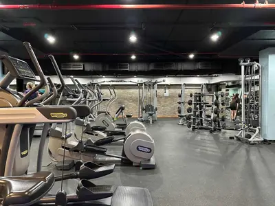 a gym with a bunch of cardio equipment in it at Upgraded 1BR Paradise With Private Garden - Oceana in Dubai