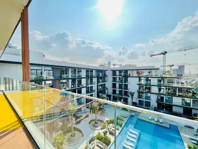 a balcony with a view of a building at Brand New Luxury 1 Bedroom Apartment in Dubai