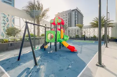 a playground in the water in a building at GuestReady - Bella Rose residence in Dubai in Dubai