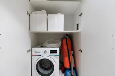 a laundry room with a washer and dryer at Modern 1-bedroom apartment in family-friendly residence with Swimming Pool, Gym & Free Parking. in Dubai