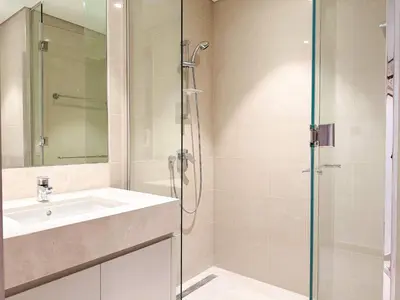 a bathroom with a sink and a shower at Unique Burj Khalifa View 3BR Condo On Top Floor in Dubai