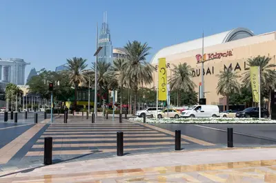 a city street with cars parked in front of a building at Frank Porter - Reva Residence in Dubai