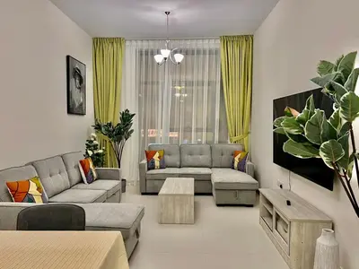 a living room with two couches and a table at 1o mins to metro. New. Stylish in Dubai