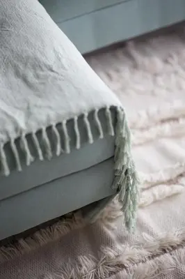 a close up of a pillow on a bed at Quiet 1BR with river view in Dubai