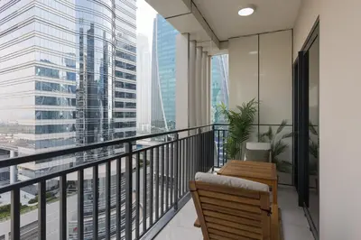 a balcony with a view of a city at Quiet 1BR with river view in Dubai