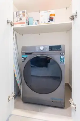 a microwave oven in a shelf in a room at The Legend Fashionable 2 Bed Apartment in Downtown in Dubai