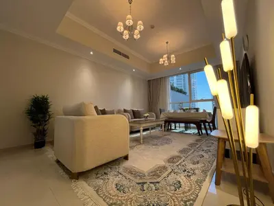 a living room with a couch and a table at 3 Minutes to Dubai Mall! DVR Vacation Homes in Dubai