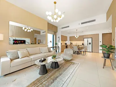 a living room with a couch and a table at Luxurious & Spacious 2BR l Burj & Fountain Views l Walk to Dubai Mall l Pool l Gym in Dubai