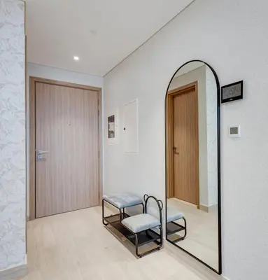 a dressing room with a mirror and a chair at Elegant 2-BR Gem Quick Access Downtown Dubai in Dubai