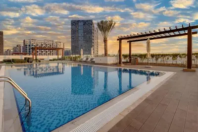 a large swimming pool on the roof of a building at Elegant 2-BR Gem Quick Access Downtown Dubai in Dubai