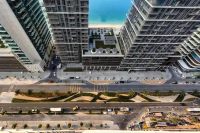 an aerial view of a city with tall buildings at Marina Vista 1BD with beach access in Beachfront in Dubai