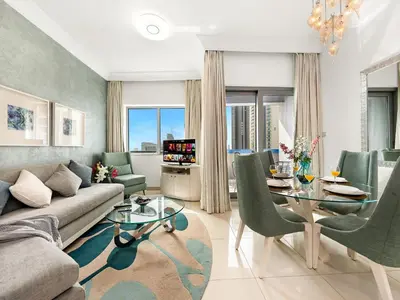 a living room with a couch and a table at Luxury 1br Burj Khalifa View in Dubai