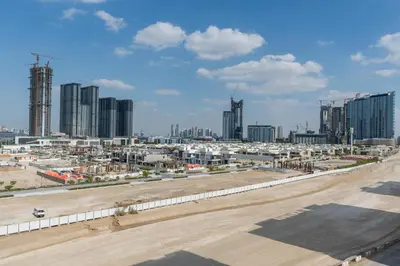 an aerial view of a city with tall buildings at ON OFF HH-Meydan One- Cozy STUDIO - Burj Khalifa & Lagoon view in Dubai