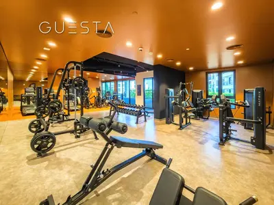 a gym with several treadmills and exercise bikes at La Voile by Merass, La Mer Dubai in Dubai