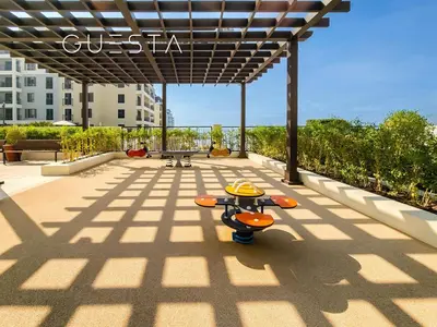 a skateboard parked under a pergola on a patio at La Voile by Merass, La Mer Dubai in Dubai