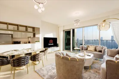 a living room with a couch and a table at Luxury 3B and maids Burj View, Steps to Dubai Mall in Dubai