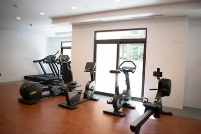 a gym with several exercise bikes in a room at Spectacular 2BR Apartment Full BurjAlArab View in Dubai