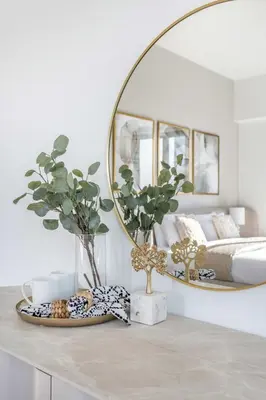 a living room with a mirror and a table at Frank Porter - Act One Act Two T1 in Dubai