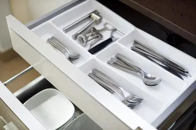 a white drawer with cutlery in a kitchen at BRAND NEW LUXURY 1 BR Apartment at Marina Gate 2 full Marina view in Dubai