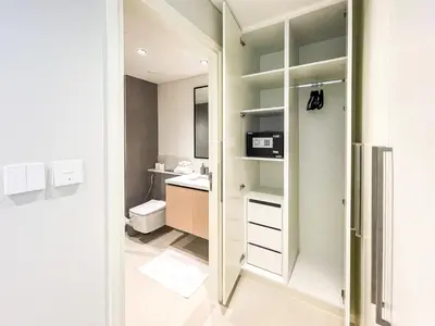 a small bathroom with a toilet and a sink at Amazing Apartment with City Views in Downtown 164BC-2 in Dubai