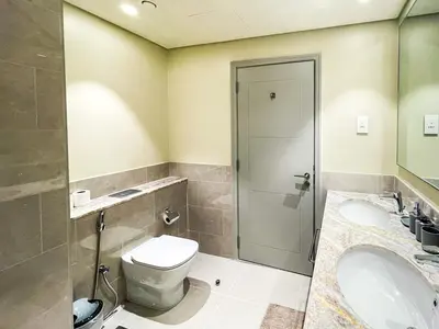 a bathroom with a toilet and a sink at Cozy Apartment with City Views Next to Burj Khalifa 166FO1-2 in Dubai