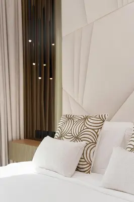 a bedroom with a bed with two pillows at Daniels 2BR at Downtown with Burj Khalifa View in Dubai