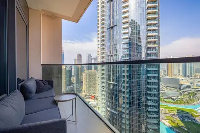 a balcony with a view of a tall building at Daniels 3BR Urban Retreat with Downtown Views in Dubai