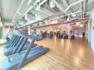 a gym with several treadmills and cardio machines at RH- Live in Luxury, 01BR with spectacular view in Dubai