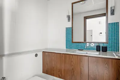 a bathroom with a sink and a mirror at Luxury 1BR - Leisure Facilities Access - Sea View in Dubai