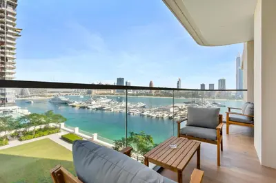 a living room with a view of a harbor at Luxurious Living in the heart of Emaar Beachfront in Dubai
