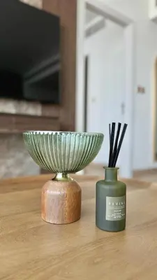 a bowl and a vase sitting on a table at LUXURY SPACIOUS - 1 BR - SKY GARDENS DIFC - Heart of Trade Centre and Dubai Mall in Dubai