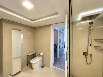 a bathroom with a shower and a toilet and a sink at Rimal 3 - Incredible Two Bedroom in Dubai