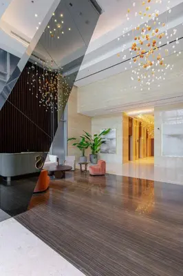 a lobby with a staircase in a building at Luxury Glam Studio Near Burj Khalifa Downtown in Dubai