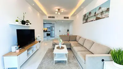 a living room with a couch and a tv at Dubai Marina (Marina Diamond 2) 1 Bedroom Apt. in Dubai