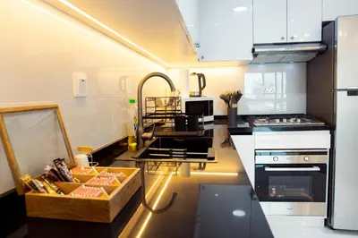 a kitchen with a box of food on a counter at Dubai Marina (Marina Diamond 2) 1 Bedroom Apt. in Dubai