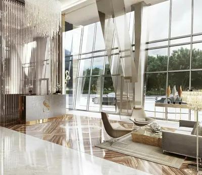 a living room with a chandelier and a couch at Canal-View Serenity: Modern Studio in Sterling in Dubai