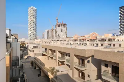 a view of a city with tall buildings at ALiving Stylish 1BR Apartment I Fully Furnished with Balcony I Belgravia Square, JVC in Dubai