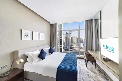 a hotel room with a bed and a large window at ALiving Deluxe Studio I DAMAC Maison Prive, Business Bay -1204 in Dubai